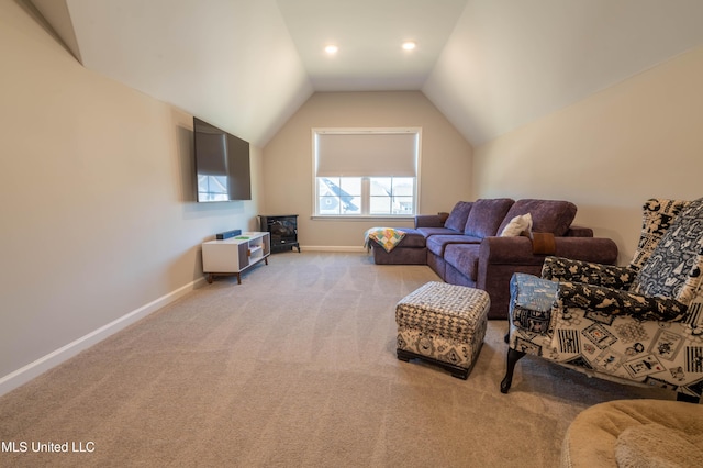 carpeted living room featuring lofted ceiling