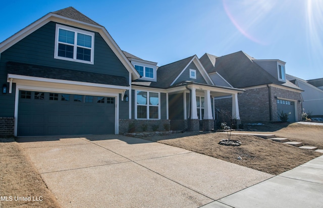 craftsman-style home featuring a porch and a garage