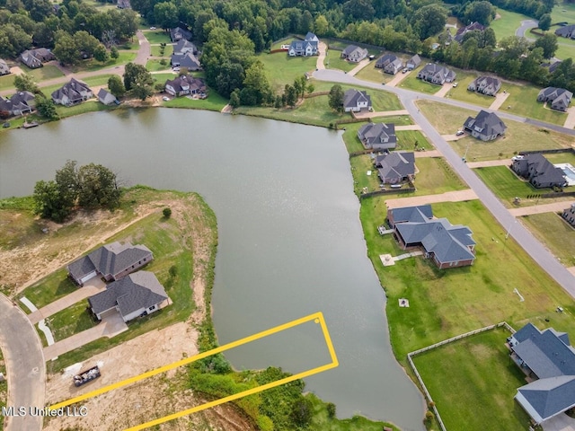 bird's eye view featuring a water view and a residential view