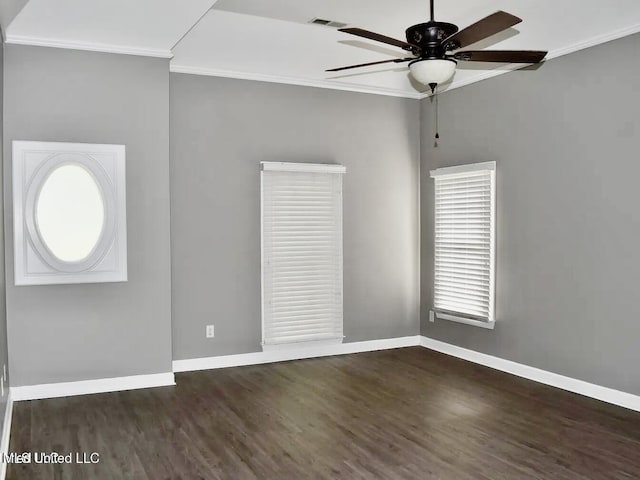 unfurnished room with ceiling fan, dark hardwood / wood-style flooring, and crown molding