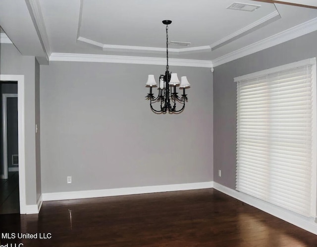 unfurnished dining area with ornamental molding, a chandelier, a raised ceiling, and dark hardwood / wood-style floors