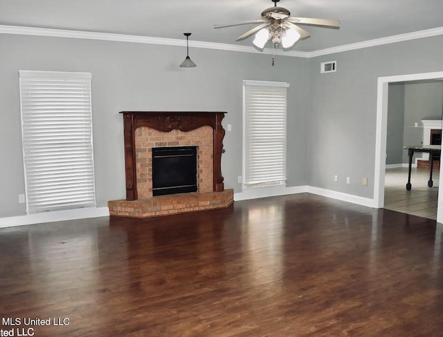 unfurnished living room with dark hardwood / wood-style flooring, a fireplace, and ornamental molding