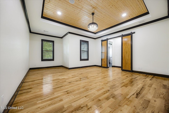 unfurnished room with light wood-style flooring, wood ceiling, and a raised ceiling