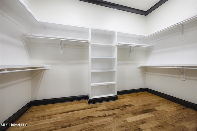 spacious closet with wood finished floors