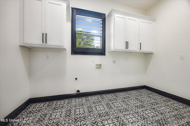 washroom featuring electric dryer hookup, hookup for a gas dryer, cabinet space, baseboards, and hookup for a washing machine