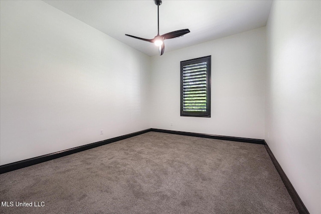 carpeted spare room with baseboards