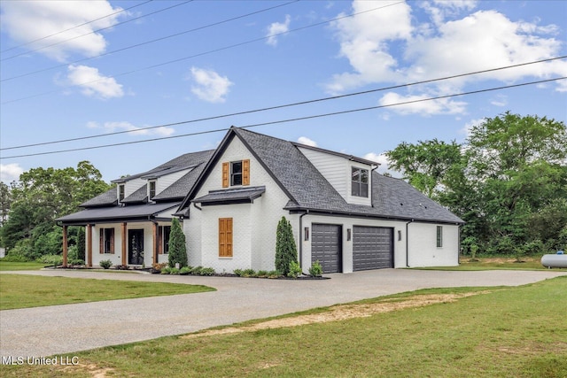 modern farmhouse style home with brick siding, aphalt driveway, roof with shingles, and a front yard