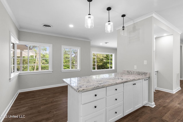 112 Louis Wilson Dr, Brandon, MS 39042 - kitchen featuring dark wood-style flooring, a peninsula, light stone countertops, ornamental molding, and white cabinets