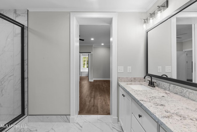 112 Louis Wilson Dr, Brandon, MS 39042 - bathroom featuring marble look tile flooring, vanity, ornamental molding, a shower stall, and recessed lighting