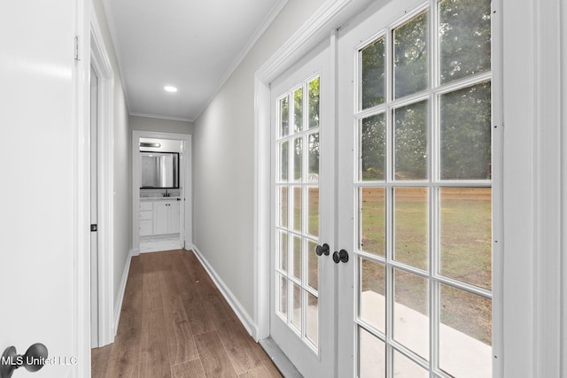 112 Louis Wilson Dr, Brandon, MS 39042 - hallway featuring crown molding, wood finished floors, and french doors
