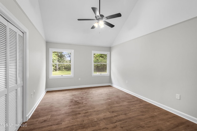 112 Louis Wilson Dr, Brandon, MS 39042 - unfurnished bedroom with high vaulted ceiling, dark wood-style flooring, a closet, and a ceiling fan
