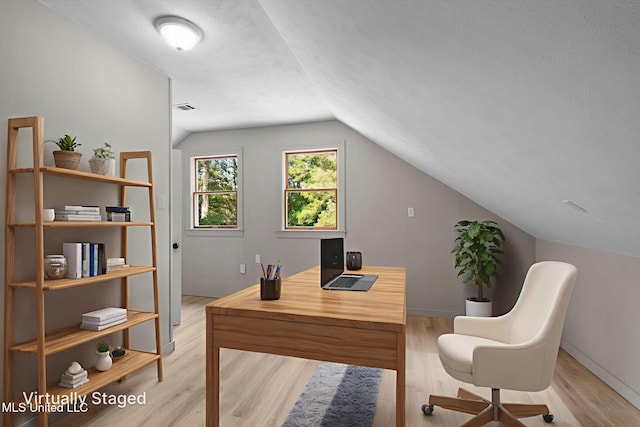 112 Louis Wilson Dr, Brandon, MS 39042 - office area with lofted ceiling and light wood-style floors