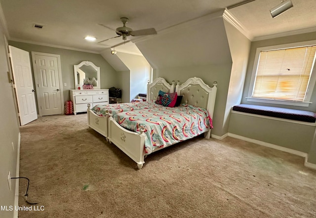 carpeted bedroom with ornamental molding, vaulted ceiling, and ceiling fan