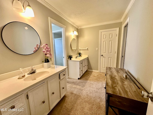 bathroom featuring vanity, crown molding, and a textured ceiling