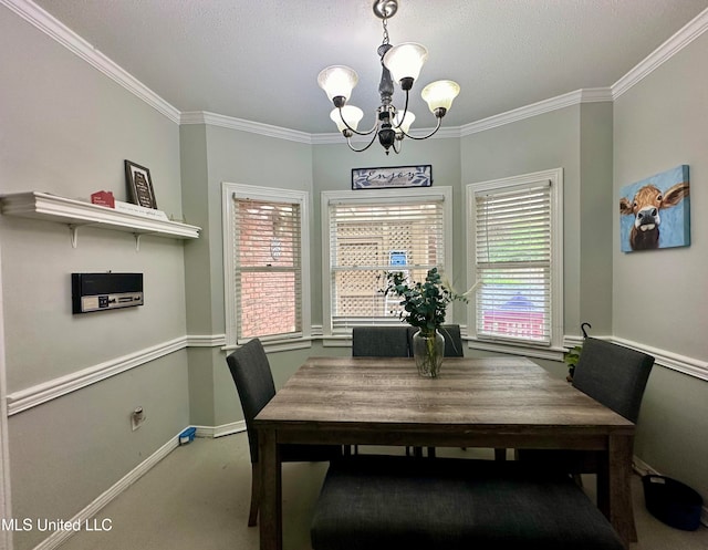 dining area featuring carpet, a notable chandelier, ornamental molding, and a textured ceiling