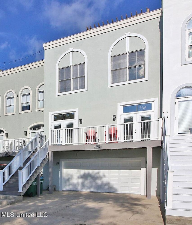 rear view of property with a garage