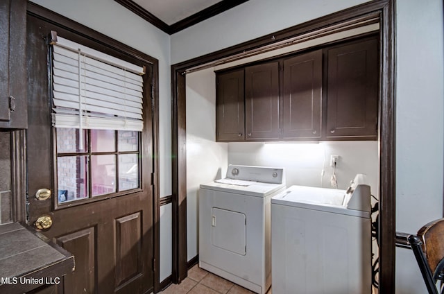 100 Eager St Unit C, Clinton, MS 39056 - laundry area featuring washer and dryer, cabinet space, ornamental molding, and light tile patterned floors