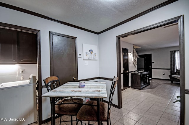 100 Eager St Unit C, Clinton, MS 39056 - dining space featuring crown molding, a textured ceiling, and light tile patterned floors