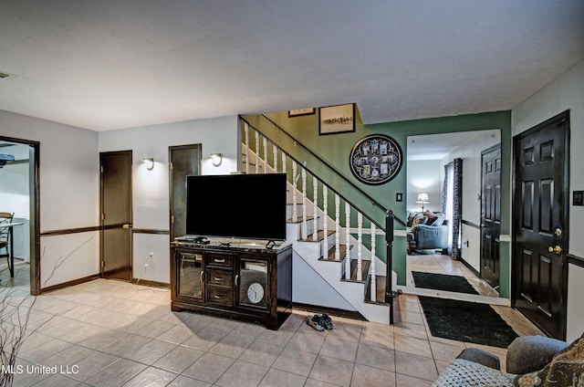 100 Eager St Unit C, Clinton, MS 39056 - tiled living room with stairs and baseboards