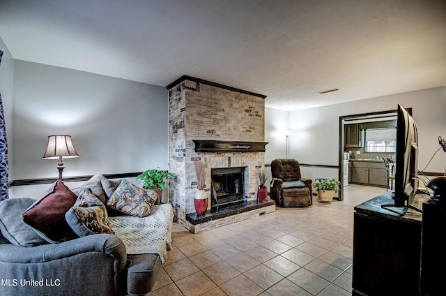 100 Eager St Unit C, Clinton, MS 39056 - living room featuring light tile patterned flooring and a brick fireplace