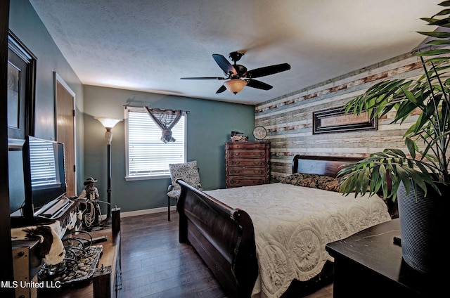100 Eager St Unit C, Clinton, MS 39056 - bedroom with an accent wall, dark wood-style floors, wood walls, and ceiling fan