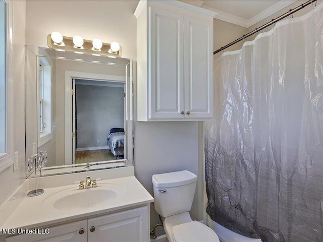 bathroom featuring ornamental molding, toilet, vanity, and a shower with curtain