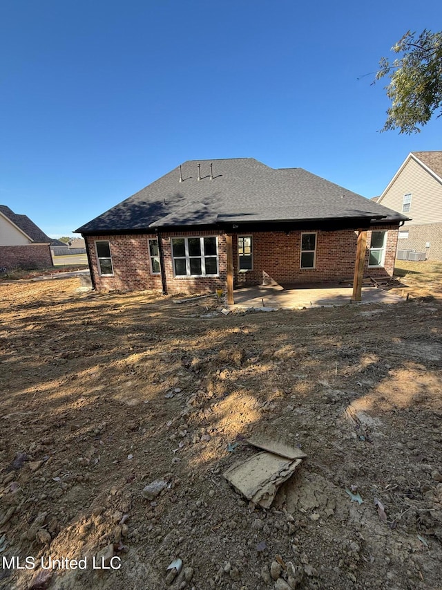 back of house with a patio