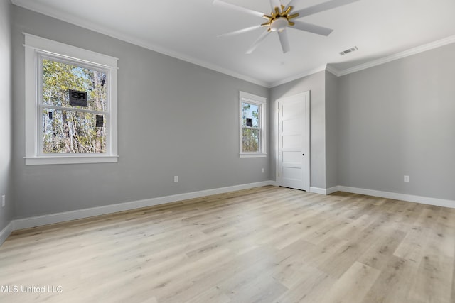 unfurnished bedroom with crown molding, light hardwood / wood-style floors, a closet, and ceiling fan