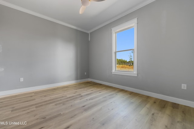 spare room featuring ceiling fan, ornamental molding, and light hardwood / wood-style floors