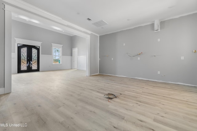 interior space with light hardwood / wood-style flooring and french doors