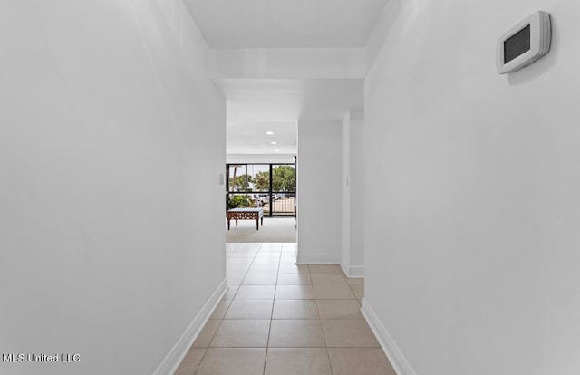 hallway featuring light tile patterned floors