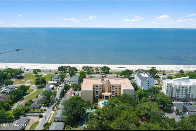 aerial view with a water view and a view of the beach