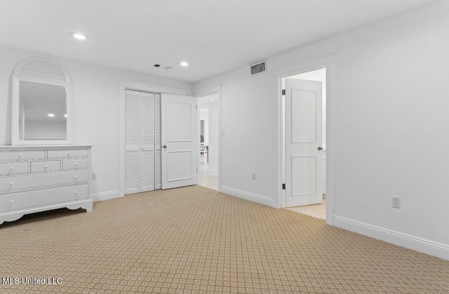 unfurnished bedroom with a closet