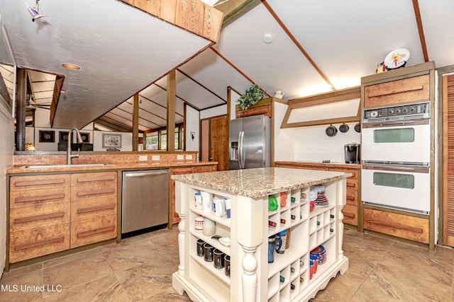 kitchen with open shelves, a sink, lofted ceiling, appliances with stainless steel finishes, and a kitchen island