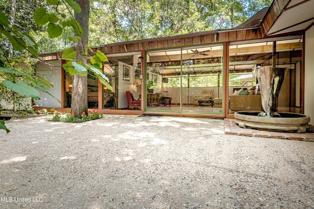 view of patio / terrace featuring a sunroom