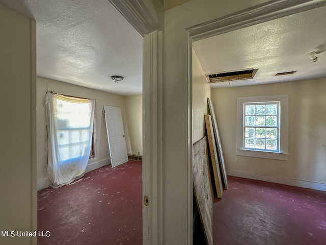 interior space featuring a textured ceiling