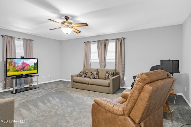 living room featuring ceiling fan, carpet flooring, and a healthy amount of sunlight