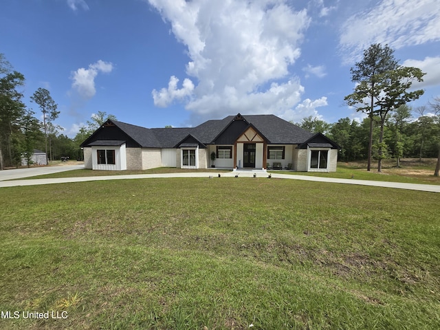modern inspired farmhouse with a front yard