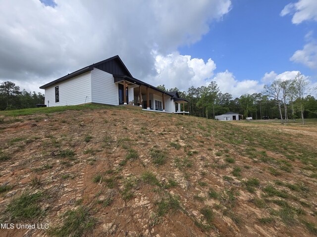 view of side of property with board and batten siding