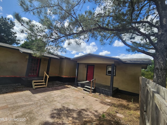 back of house featuring fence and a patio