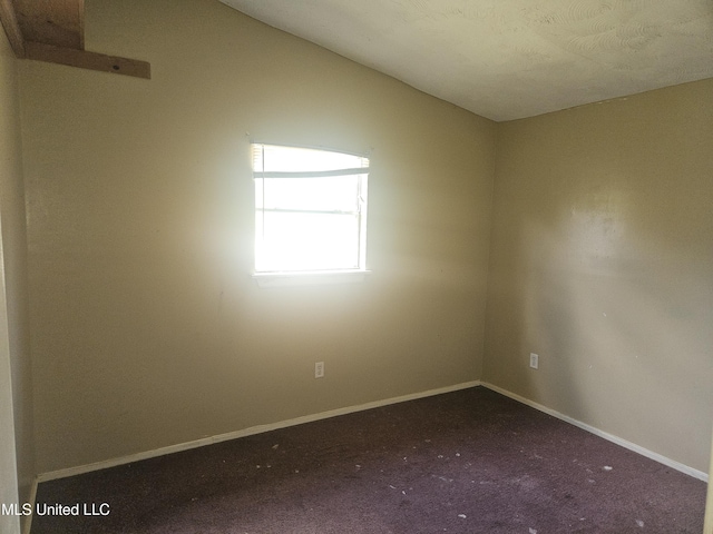 carpeted spare room with baseboards