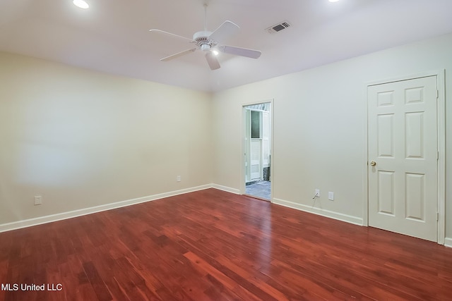 spare room with wood-type flooring and ceiling fan