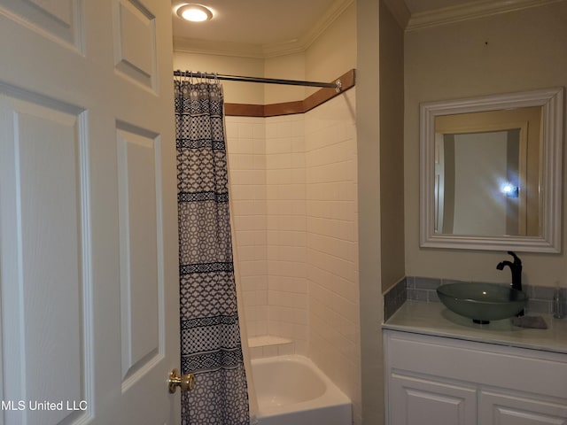 bathroom featuring crown molding, shower / tub combo with curtain, and vanity