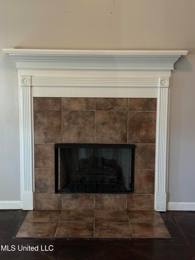 interior details with a tiled fireplace