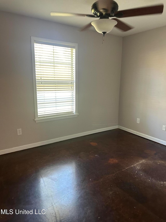 spare room with ceiling fan