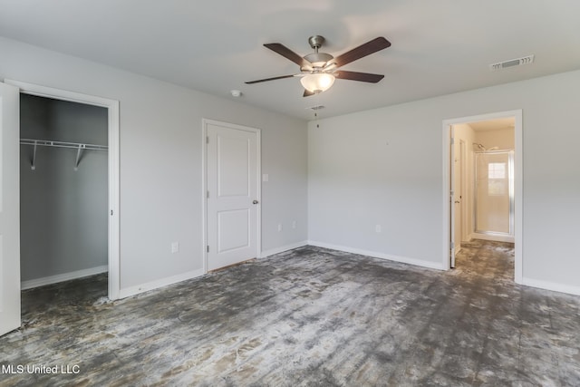 14840 Audubon Lake Blvd, Gulfport, MS 39503 - unfurnished bedroom featuring a closet, wood finished floors, a walk in closet, and ceiling fan
