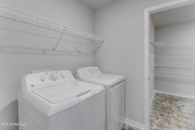14840 Audubon Lake Blvd, Gulfport, MS 39503 - laundry area with separate washer and dryer and baseboards
