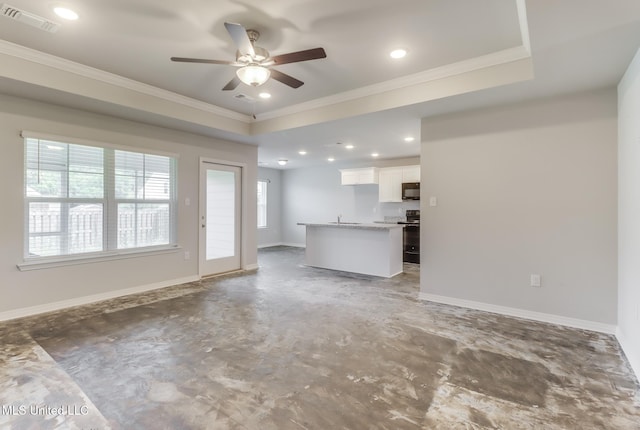 14840 Audubon Lake Blvd, Gulfport, MS 39503 - unfurnished living room with crown molding, concrete flooring, a ceiling fan, recessed lighting, and a raised ceiling