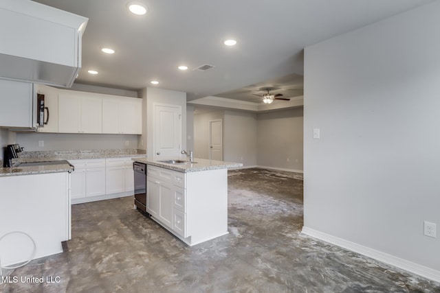 14840 Audubon Lake Blvd, Gulfport, MS 39503 - kitchen featuring black dishwasher, ceiling fan, recessed lighting, a tray ceiling, and a center island with sink
