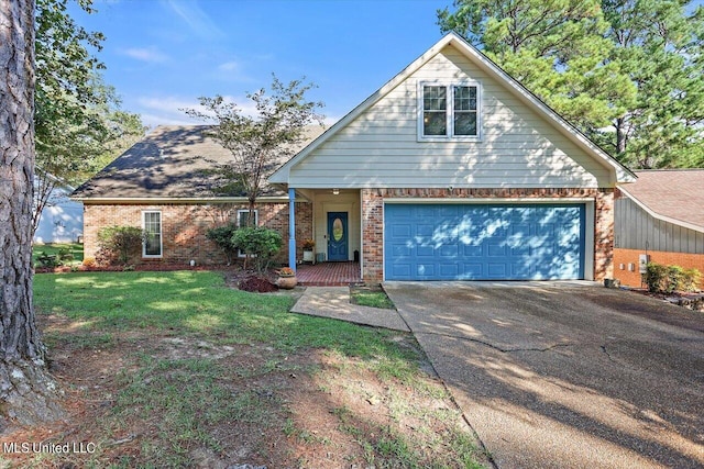 view of property featuring a front yard and a garage